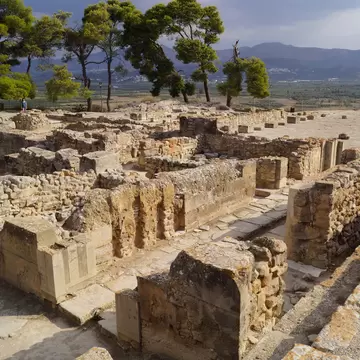 Ruins of the ancient Minoan Palace of Phaistos (Festos) with the Messara mountains in the background.