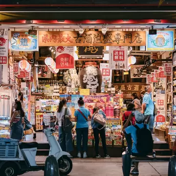 OKINAWA, JAPAN - SEP 2, 2019 : Okinawa Souvenir shop on  Kokusai dori Shopping street Naha Tourist people buy Okinawa Product Duty free shop Tax free, License Type: media, Download Time: 2026-02-05T10:29:33.000Z, User: aniabartoszek, Editorial: true, purchase_order: 56530 - Guidebooks, job: Global Publishing-WIP, client: Experience Japan 3, other: Ania Lenihan
