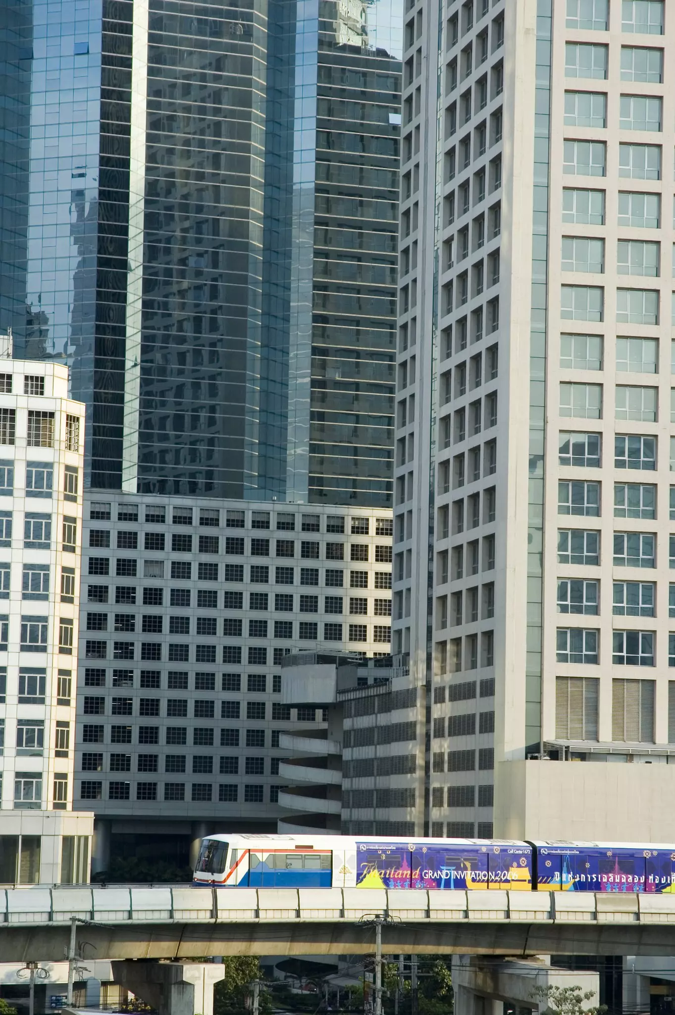 The BTS Skytrain weaving through city buildings in Bangkok