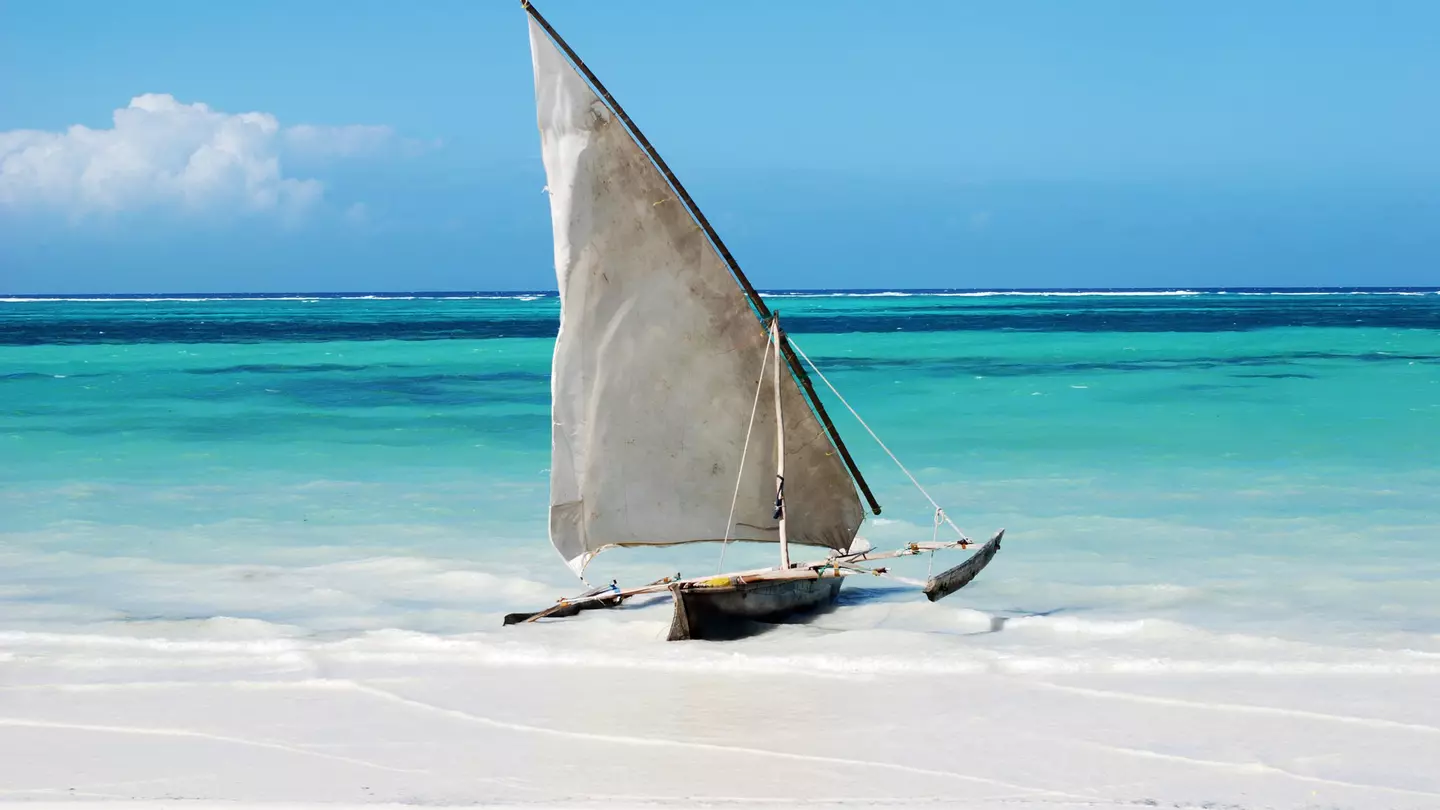 A traditional sailing boat on a beach in Zanzibar
