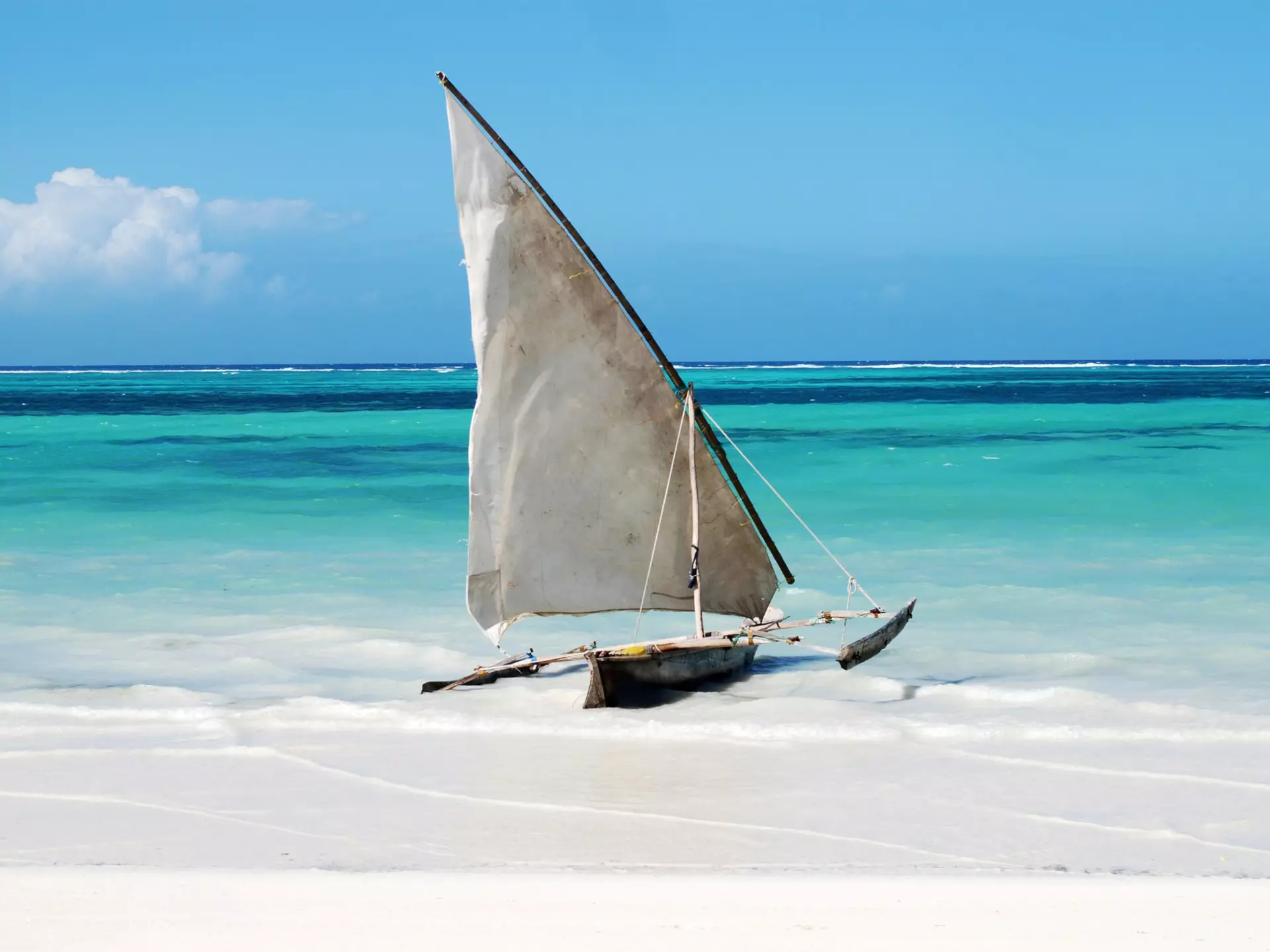 A traditional sailing boat on a beach in Zanzibar