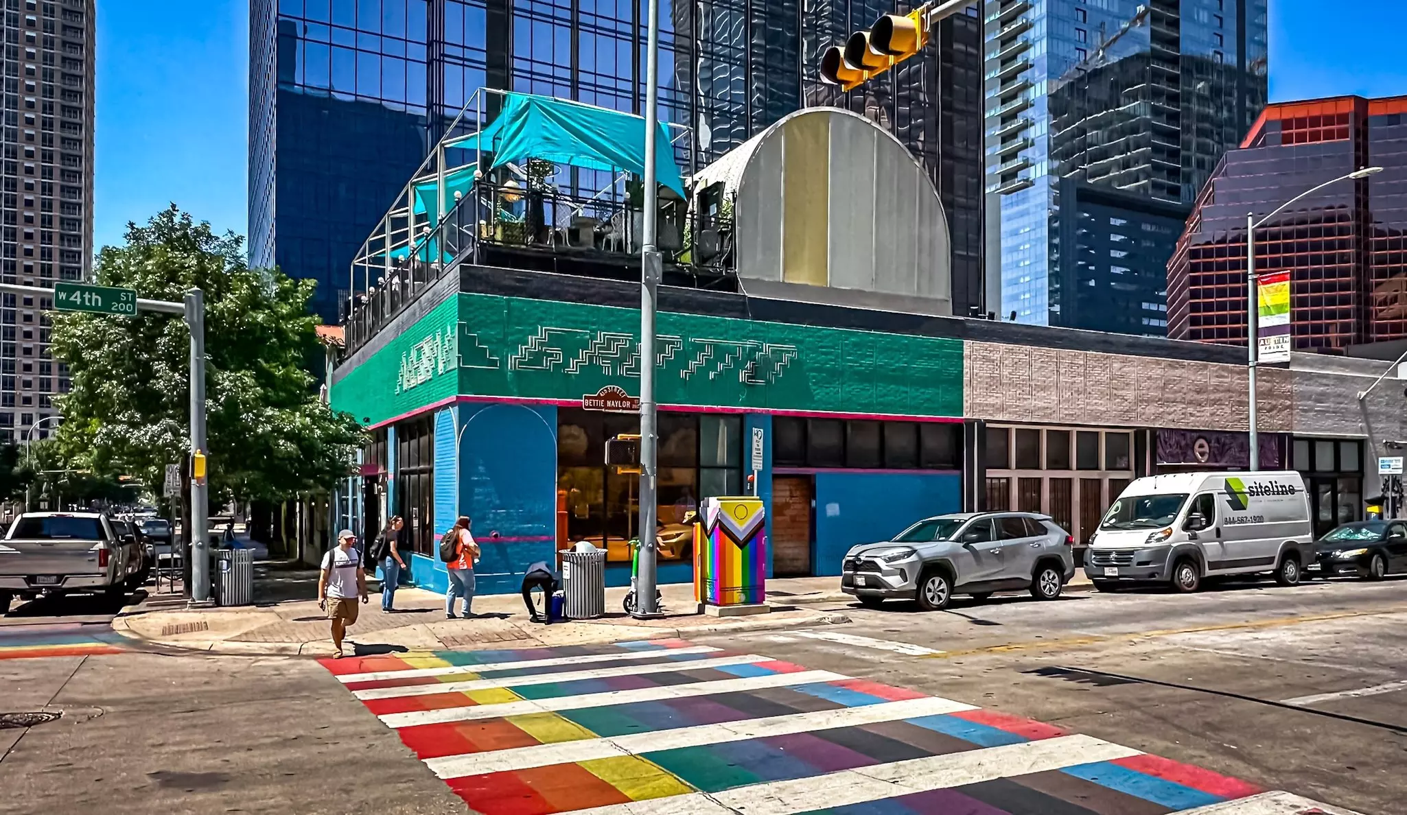 Texas, USA, May 29th 2024, view of a multicolored pedestrian crossing by Neon Grotto, a nightclub at the corner of Colorado Street and W 4th Street,