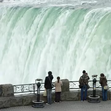 People looking at Horseshoe Falls from Table Rock viewpoint in the Niagara Falls, Canada.