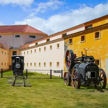 Heritage steam train locomotive in the courtyard of the Maritime Museum of Ushuaia housed in the Presidio, the old prison of Ushuaia in Tierra del Fuego, Argentina.