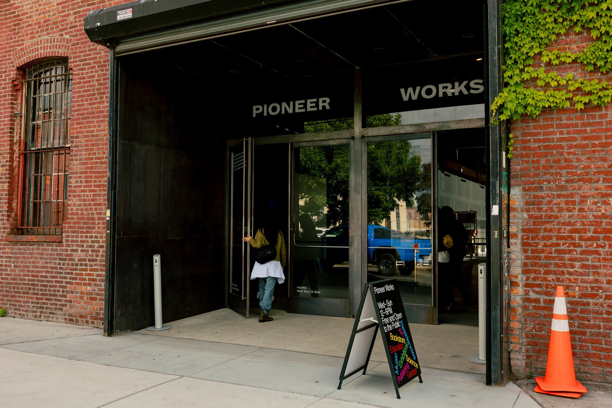 Brick and black painted entrance to Pioneer Works event space and cultural center in Red Hook, Brooklyn.
