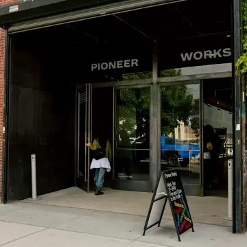 Brick and black painted entrance to Pioneer Works event space and cultural center in Red Hook, Brooklyn.
