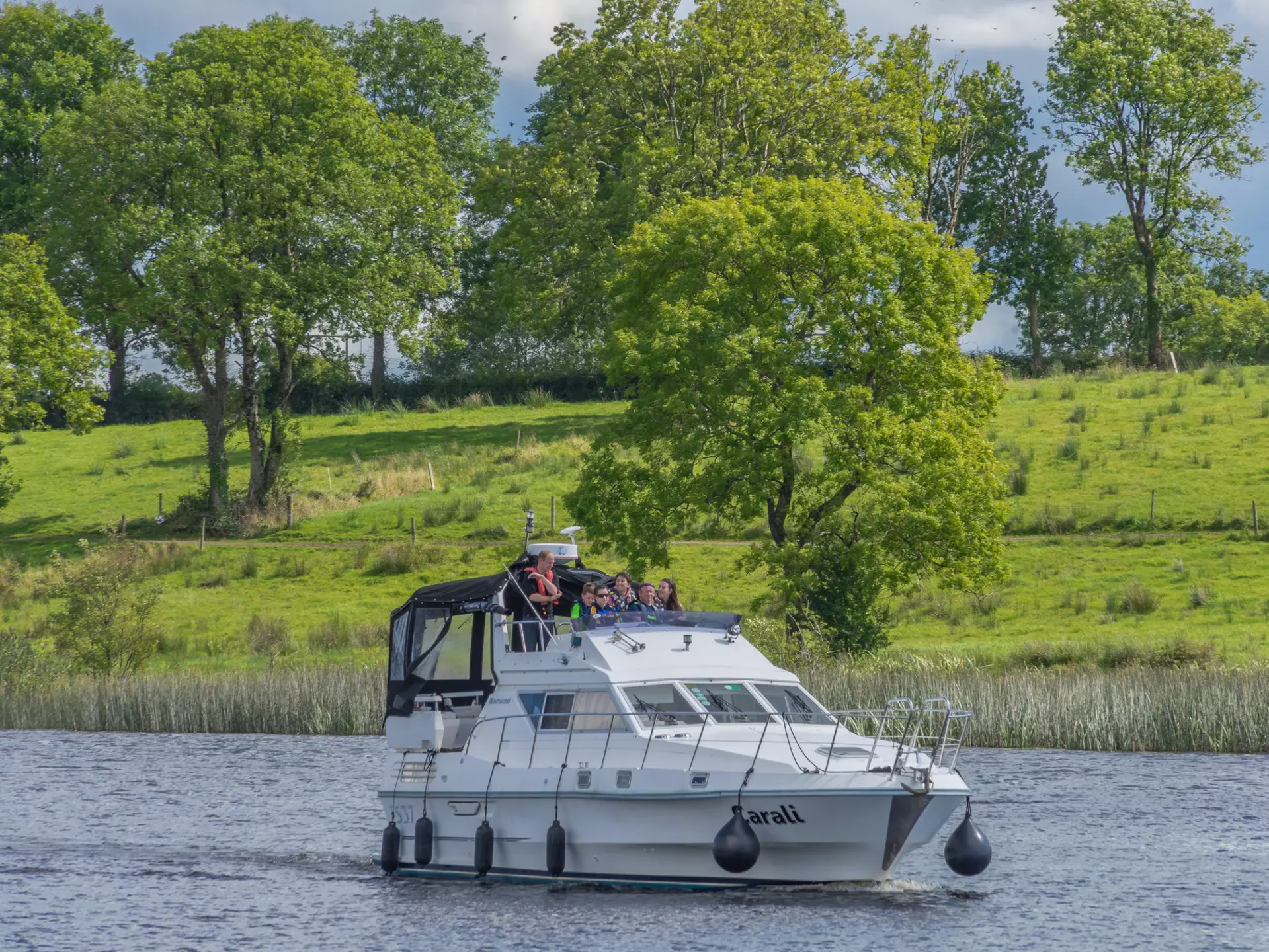 Editorial use only; a small cruise boat on the river Shannon, at Carrick on Shannon, Co. Leitrim, Ireland, in August 2016., License Type: media, Download Time: 2025-12-04T16:42:27.000Z, User: nic.dhoedt_lonelyplanet, Editorial: true, purchase_order: 56530 - Guidebooks, job: Global Publishing WIP , client: Lonely Planet Ireland 17, other: Nicolas D'Hoedt