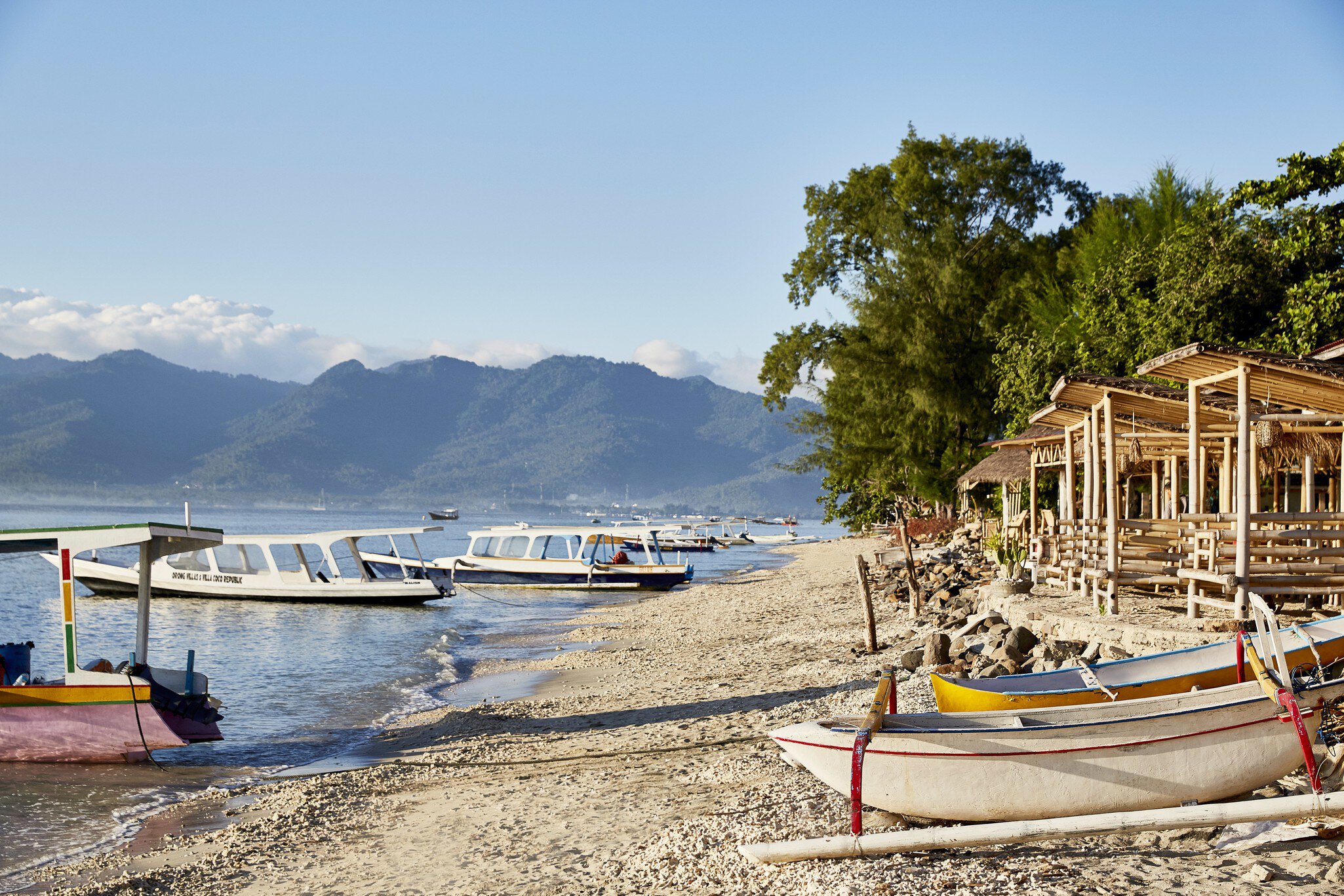 Beach huts and boats on Gili Air island, just off the coast of Lombok in Indonesia © John Laurie / Lonely Planet