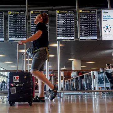 Electronic screens display flight information in the departures hall at Madrid Barajas airport