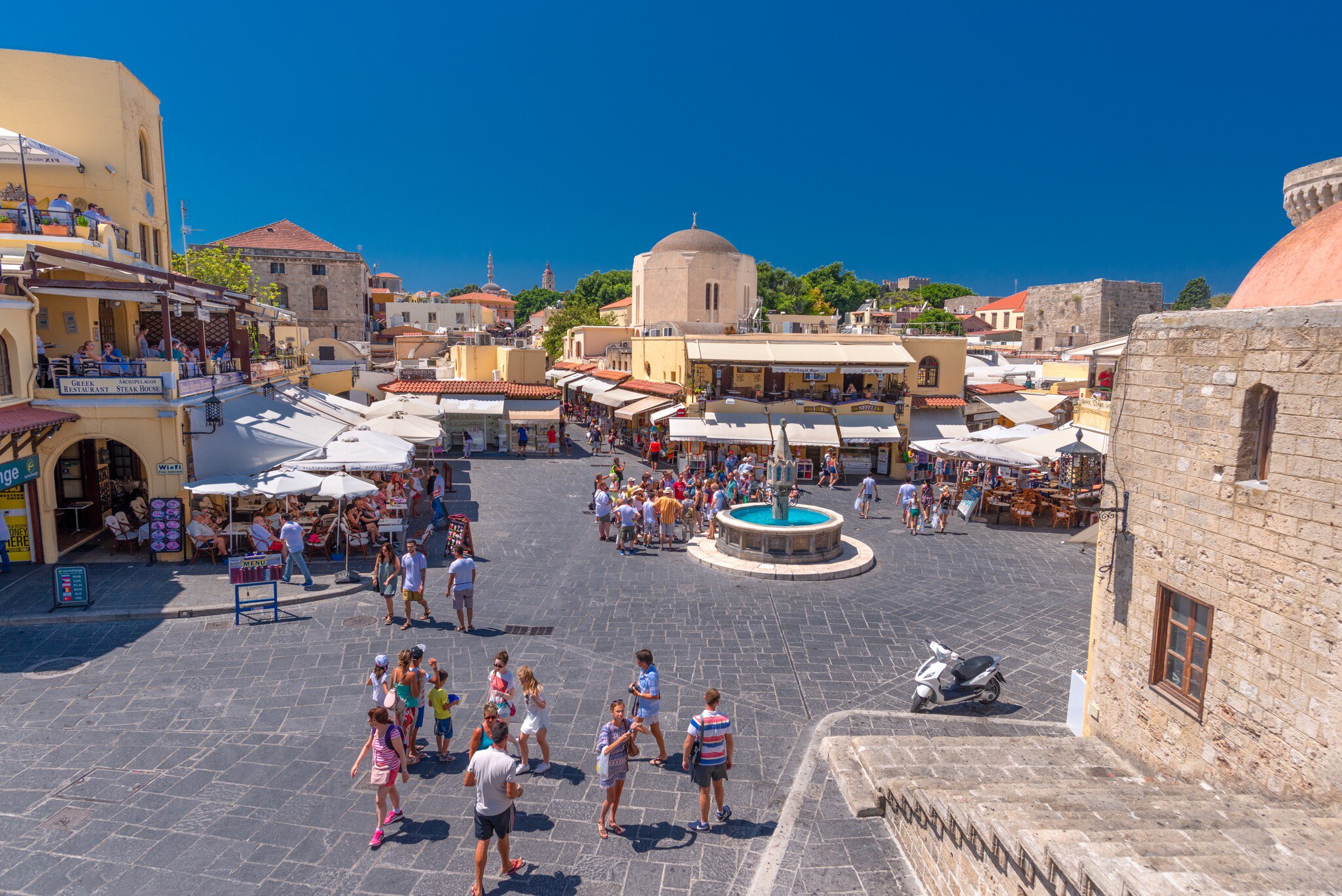 Rhodes, Greece - August 2016: Evreon Martyron Square Jewish Martyrs Square in the beautiful and flamboyant Old Medieval City of Rhodes, a popular summer tourist attraction; Shutterstock ID 1366955675;