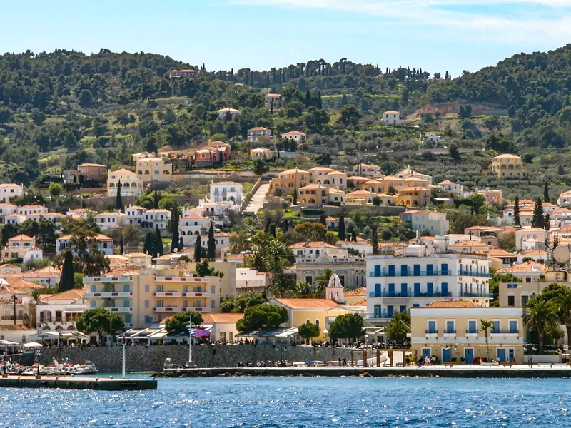 Brightly painted buildings on a hillside overlooking the water
