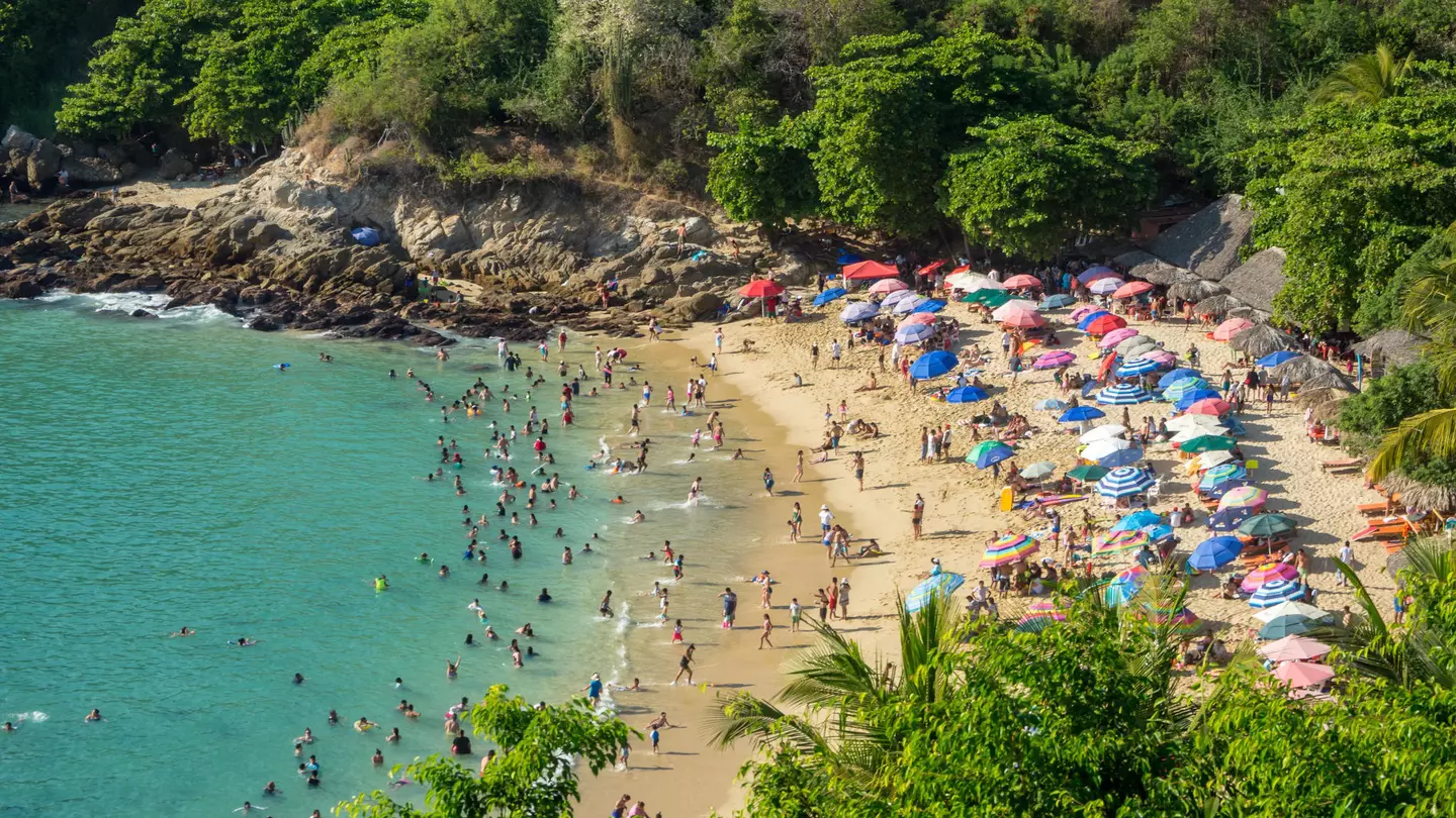 January 2018: The crowded beach of Playa Carrizalillo in Puerto Escondido.
