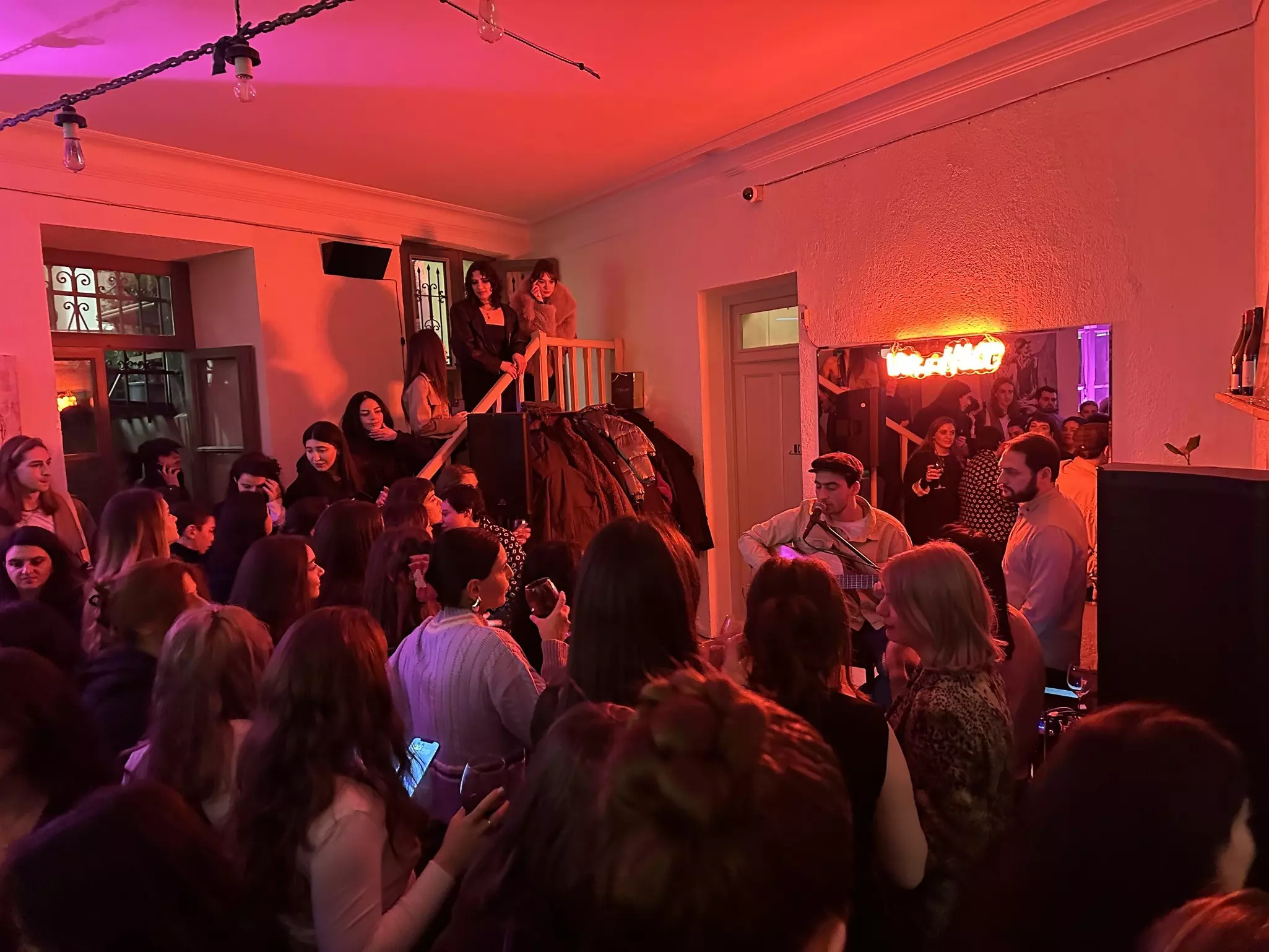 People sing Georgian songs at a wine bar in Tbilisi © Alex Butler / Lonely Planet