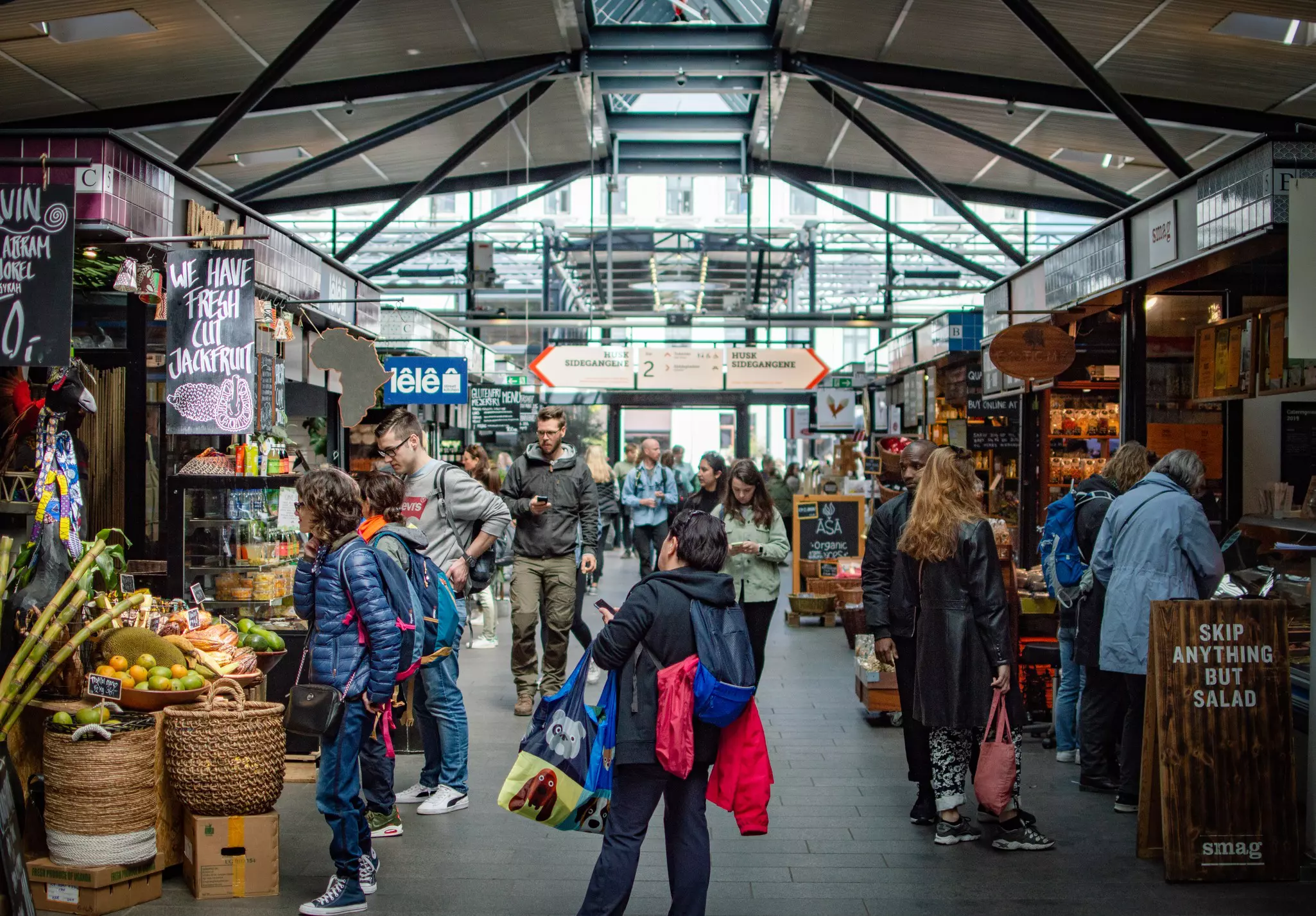 People shoping in a covered food market.