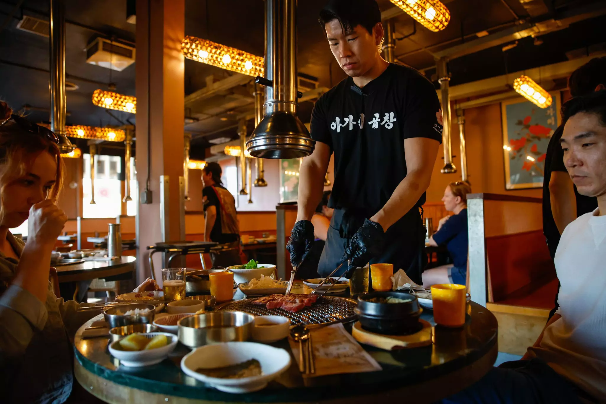 People enjoy Korean BBQ at Ahgassi Gopchang in Koreatown in Los Angeles