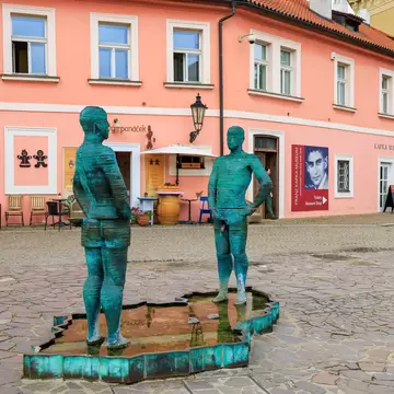  Prague, Czech Republic. The famous fountain sculpture of two blue figures, the main attraction of Prague next to the Franz Kafka Museum. 