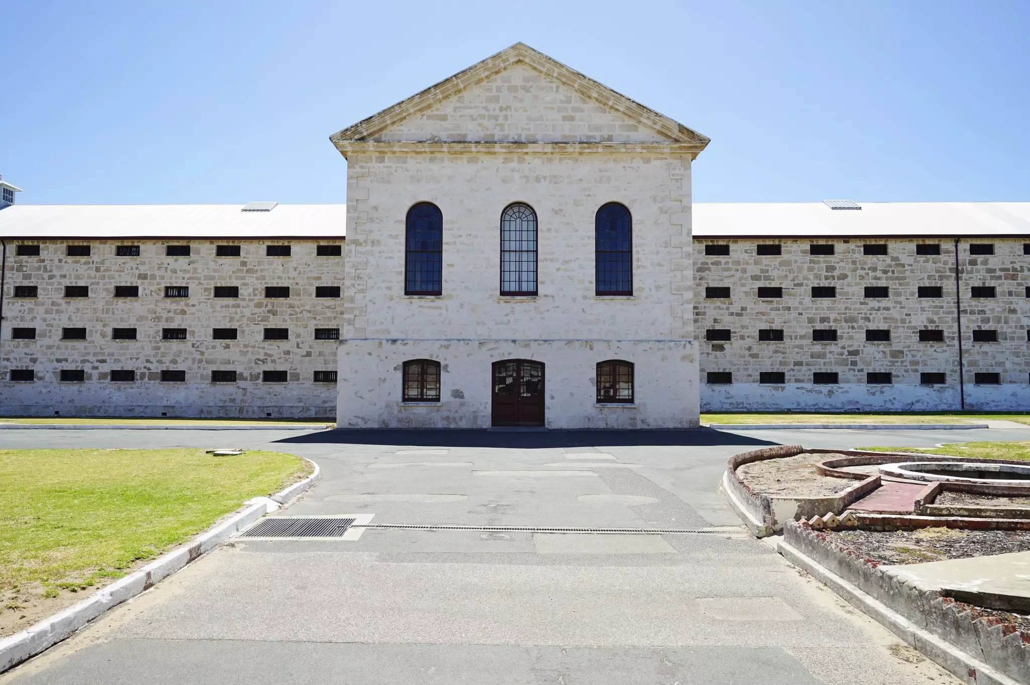The brick exterior of a large prison building.