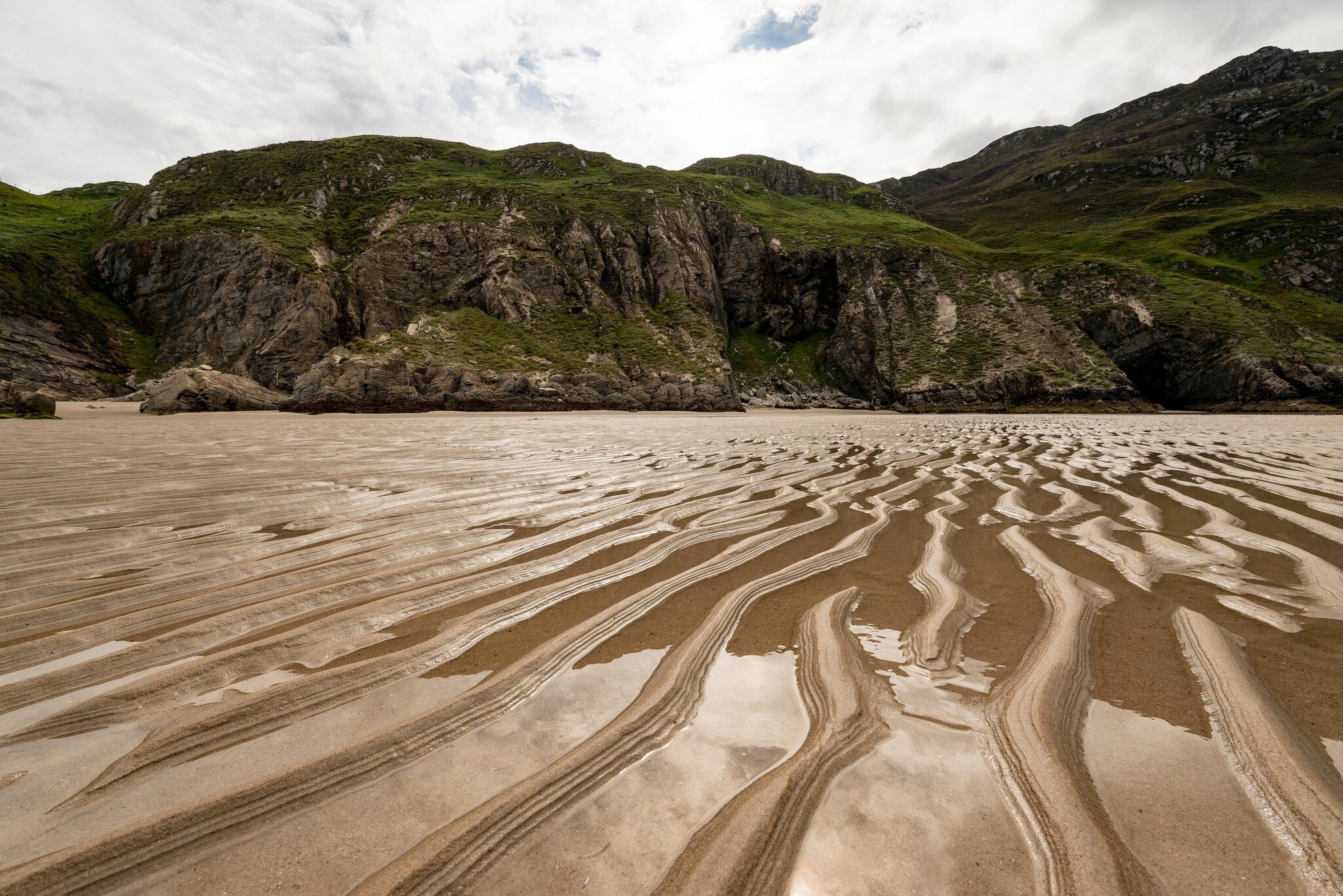 Close-up of the wavy sand at Maghera beach at ebb tide, County Donegal, Ireland; Shutterstock ID 2286569939; purchase_order: 65050; job: ; client: ; other: