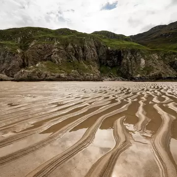 Close-up of the wavy sand at Maghera beach at ebb tide, County Donegal, Ireland; Shutterstock ID 2286569939; purchase_order: 65050; job: ; client: ; other: