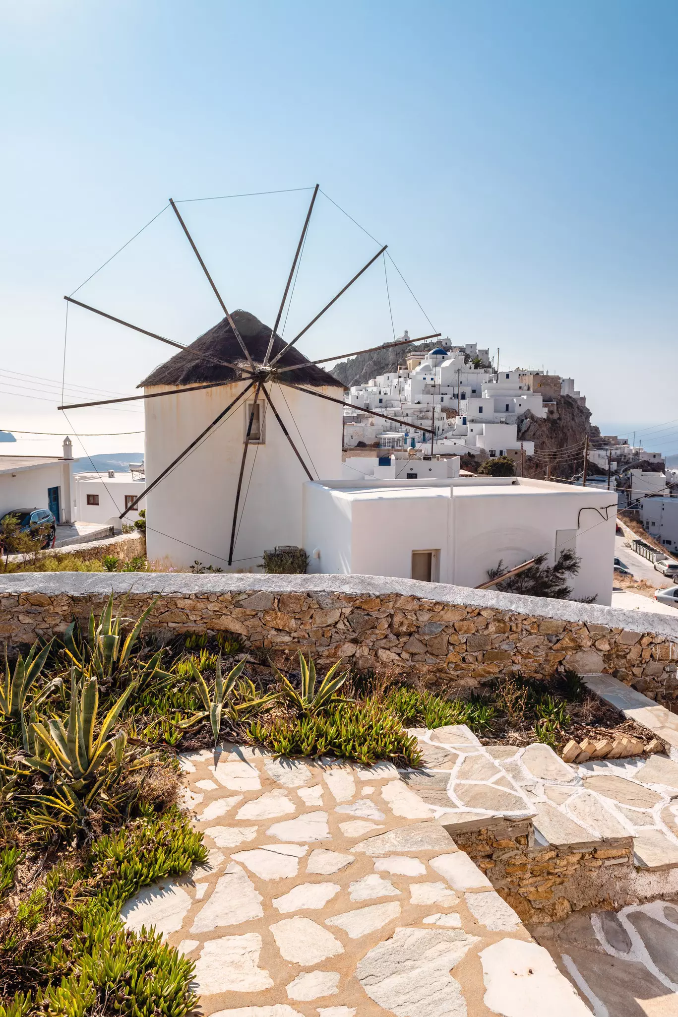 View of Hora (Chora) and a windmill in foreground. Serifos island, Greece,