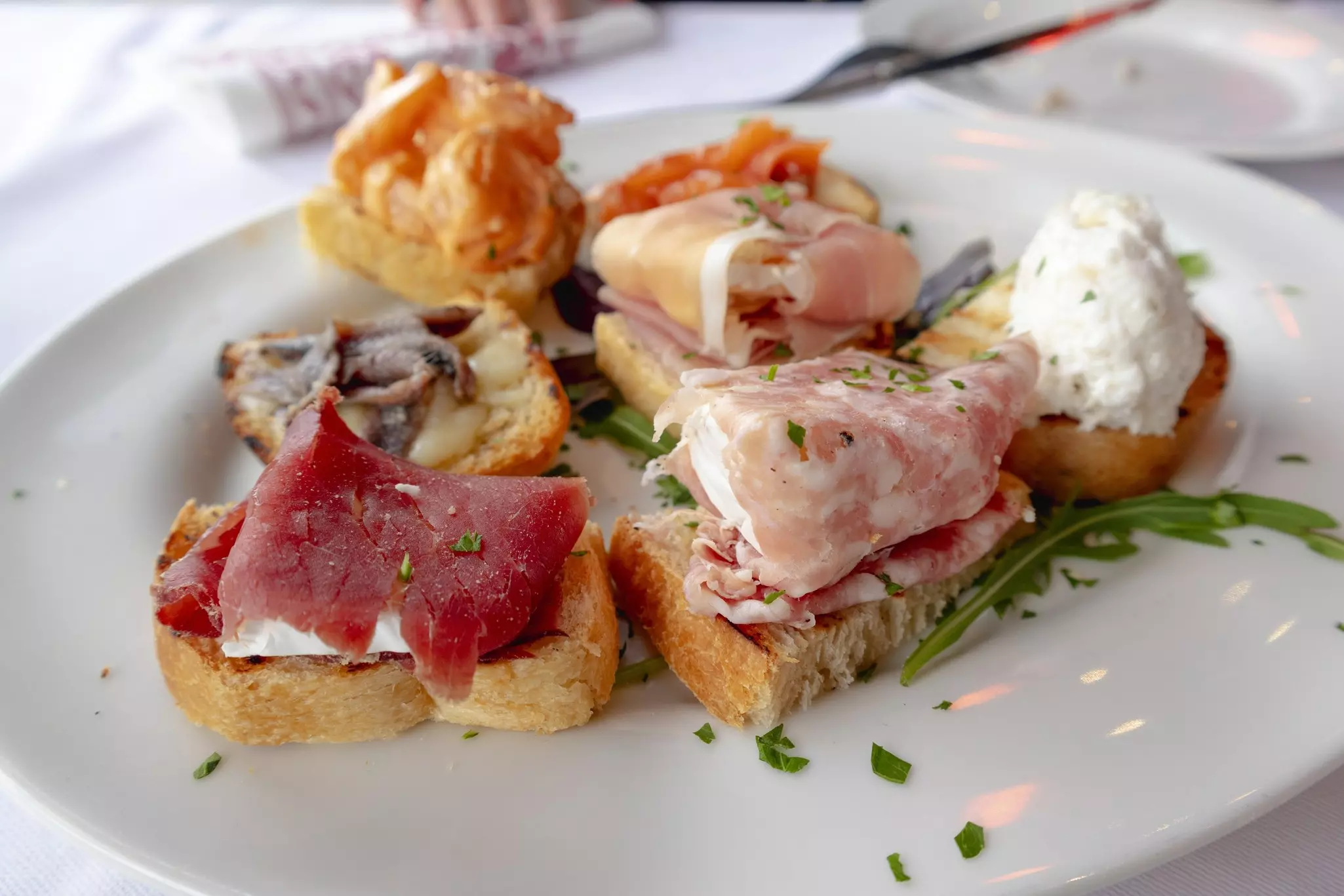 Cichetto or toasted bread with cold cuts, cheeses, creamed cod or other, Venice