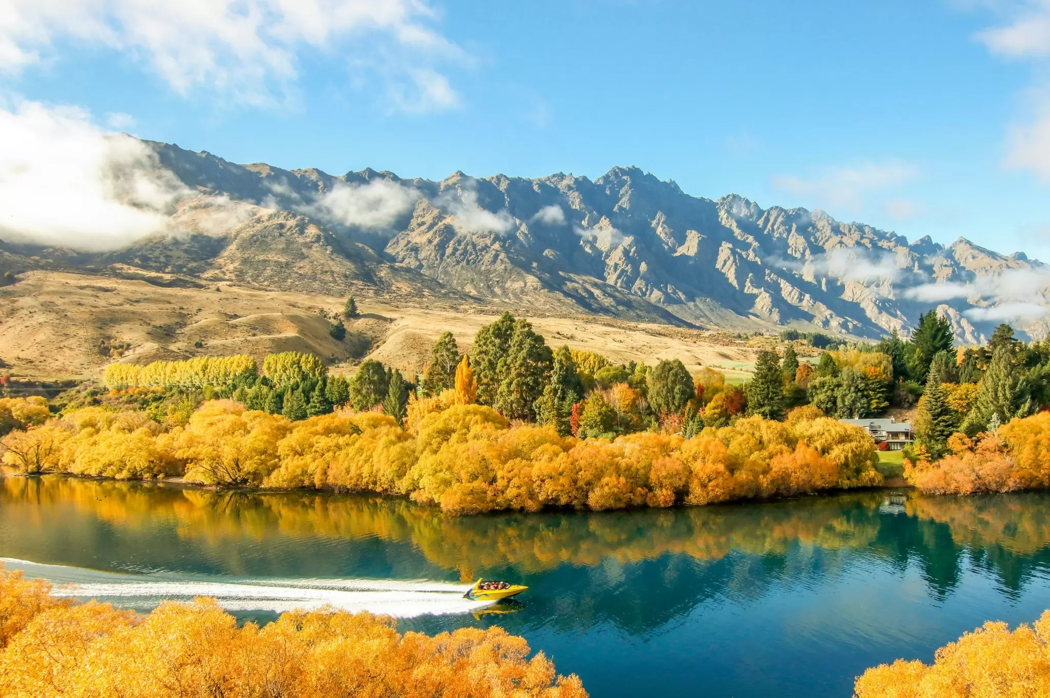 The Shotover River in fall, Queenstown. HE IS PATRICK/Shutterstock