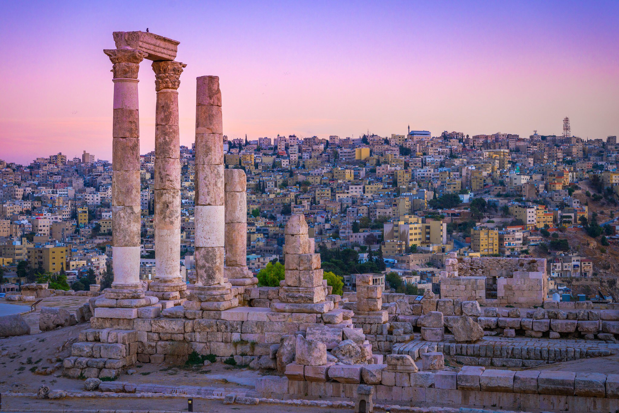 Roman ruins continuing to stand tall at the Citadel, with the centre of old Amman spread out below. mbrand85 / Shutterstock