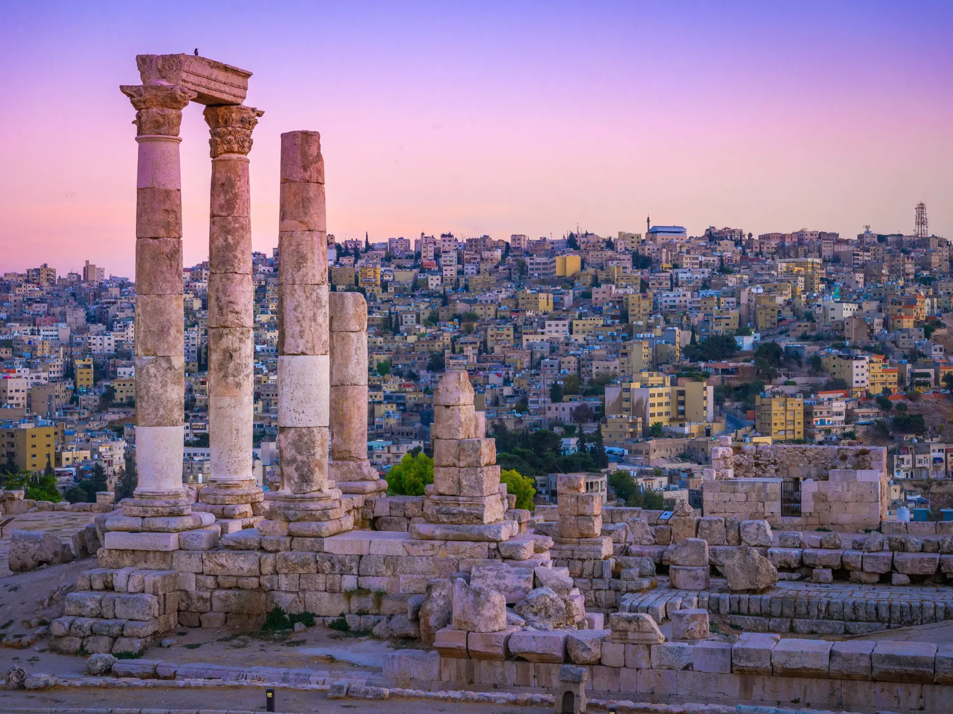 Roman ruins continuing to stand tall at the Citadel, with the centre of old Amman spread out below. mbrand85 / Shutterstock