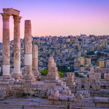Roman ruins continuing to stand tall at the Citadel, with the centre of old Amman spread out below. mbrand85 / Shutterstock