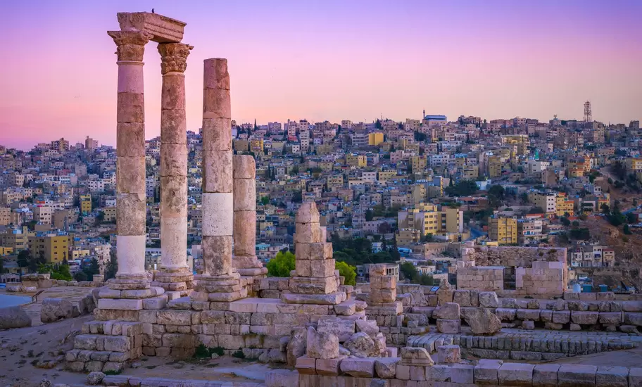 Roman ruins continuing to stand tall at the Citadel, with the centre of old Amman spread out below. mbrand85 / Shutterstock