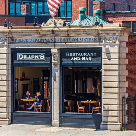 Open windows into a restaurant with Dillon's Restaurant and Bar on the sign