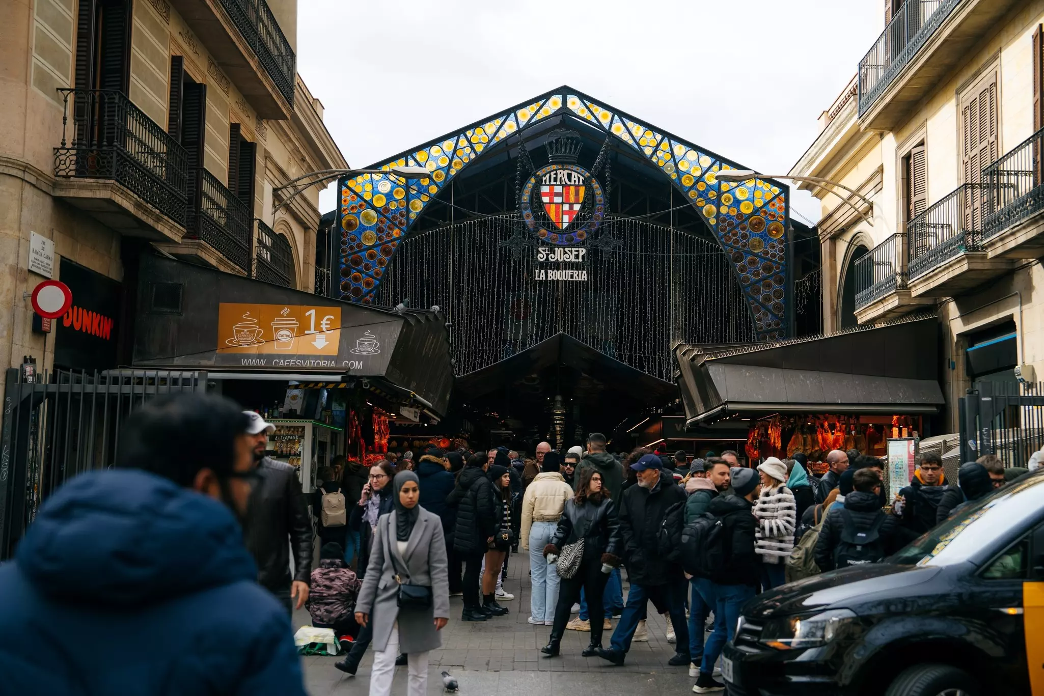 Shoppers fill the Mercat de Sant Josep de la Boqueria or Mercado de La Boqueria, is a large public market in the Ciudad Vieja district of Barcelona.,