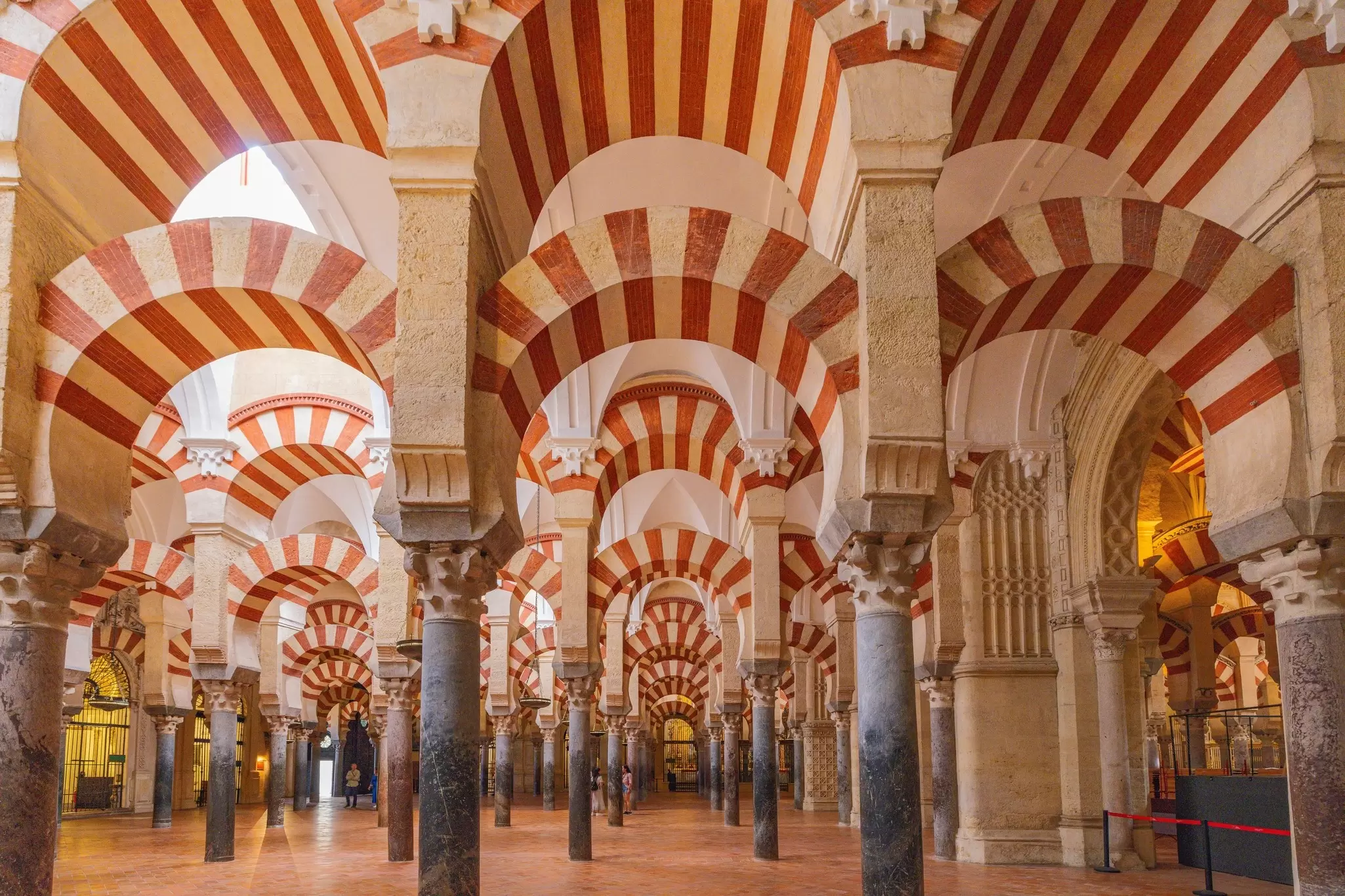View of the striped arches inside the Mezquita in Córdoba, Spain.