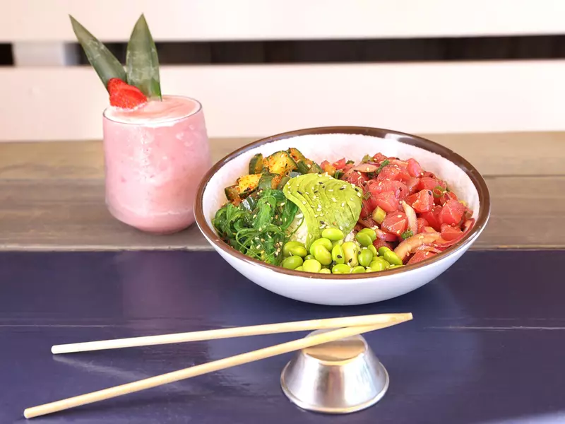 A poke bowl and a frozen pink drink.