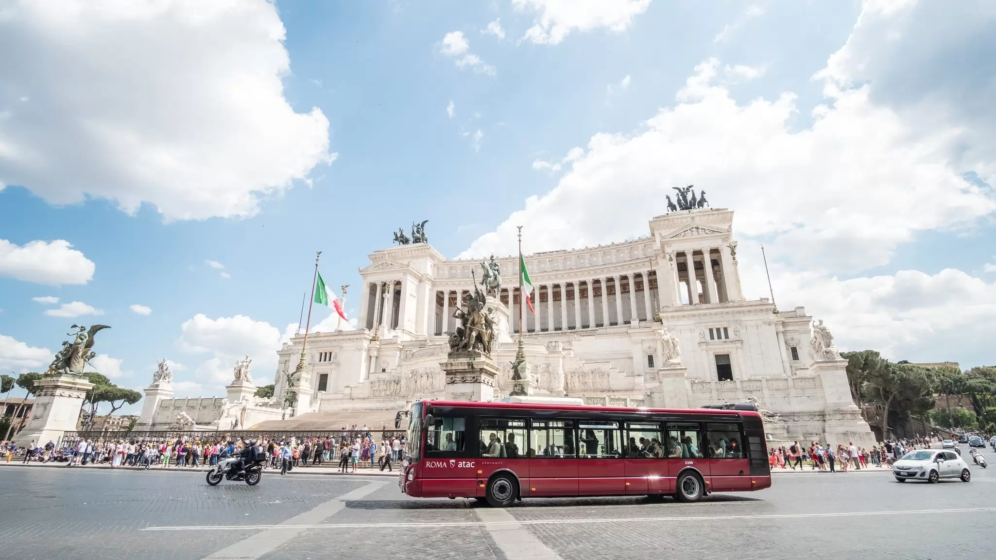 A bus passes Rome's Vittoriano. moomusician/Getty Images