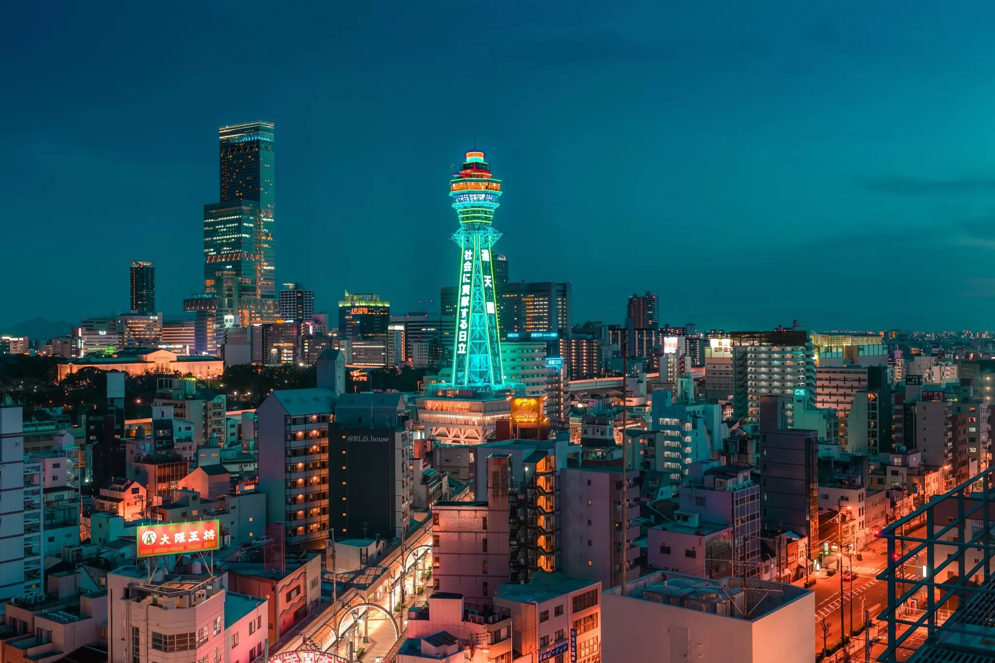 Osaka, Japan – March 28, 2024: Illuminated Tsutenkaku Tower glowing at night in the Naniwa Ward with Abeno Harukas in the background., License Type: media, Download Time: 2026-02-05T10:26:31.000Z, User: aniabartoszek, Editorial: true, purchase_order: 56530 - Guidebooks, job: Global Publishing-WIP, client: Experience Japan 3, other: Ania Lenihan