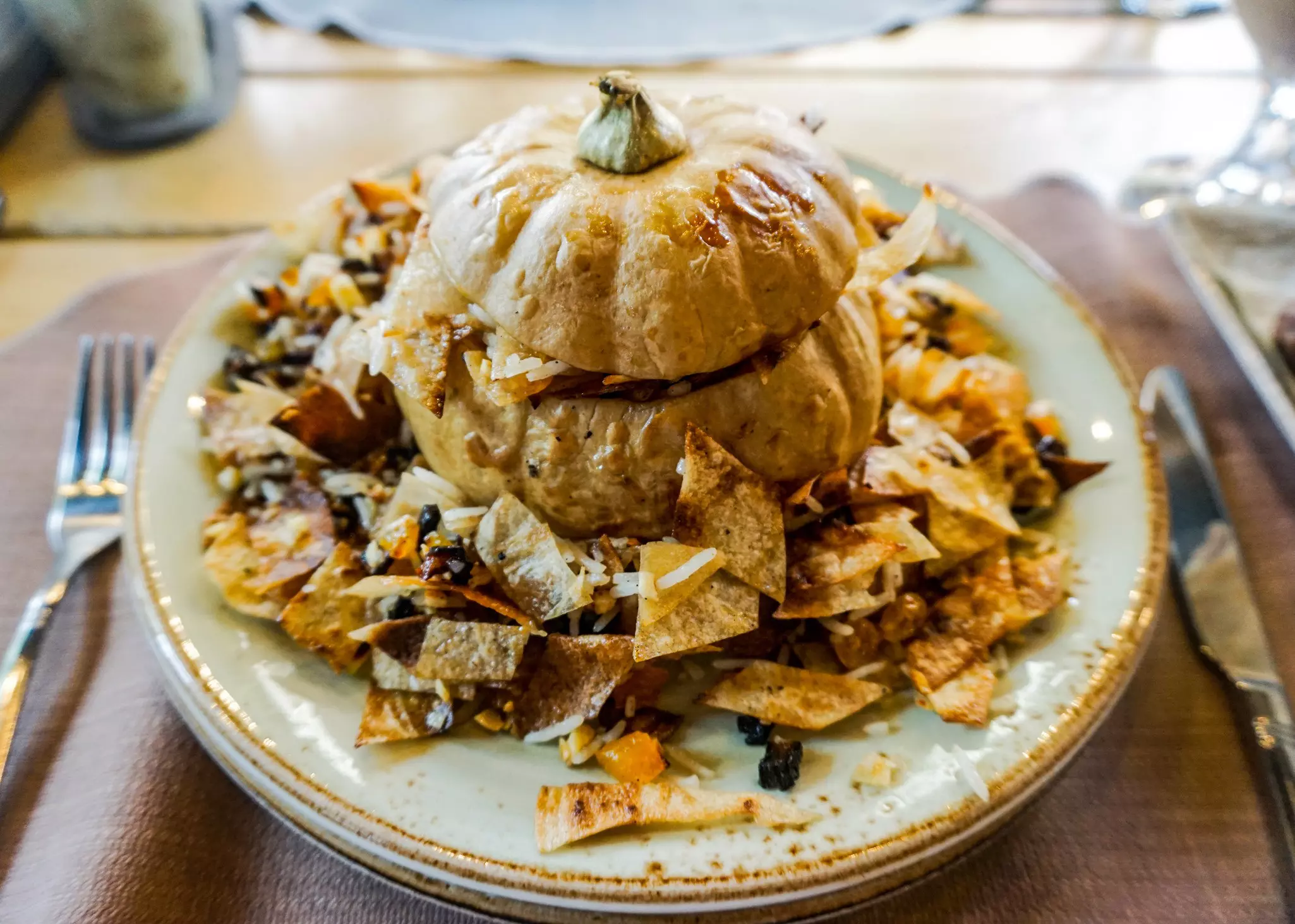 Ghapama is a stuffed pumpkin with rice, dried fruits and nuts and served with bread © AlexelA/Shutterstock