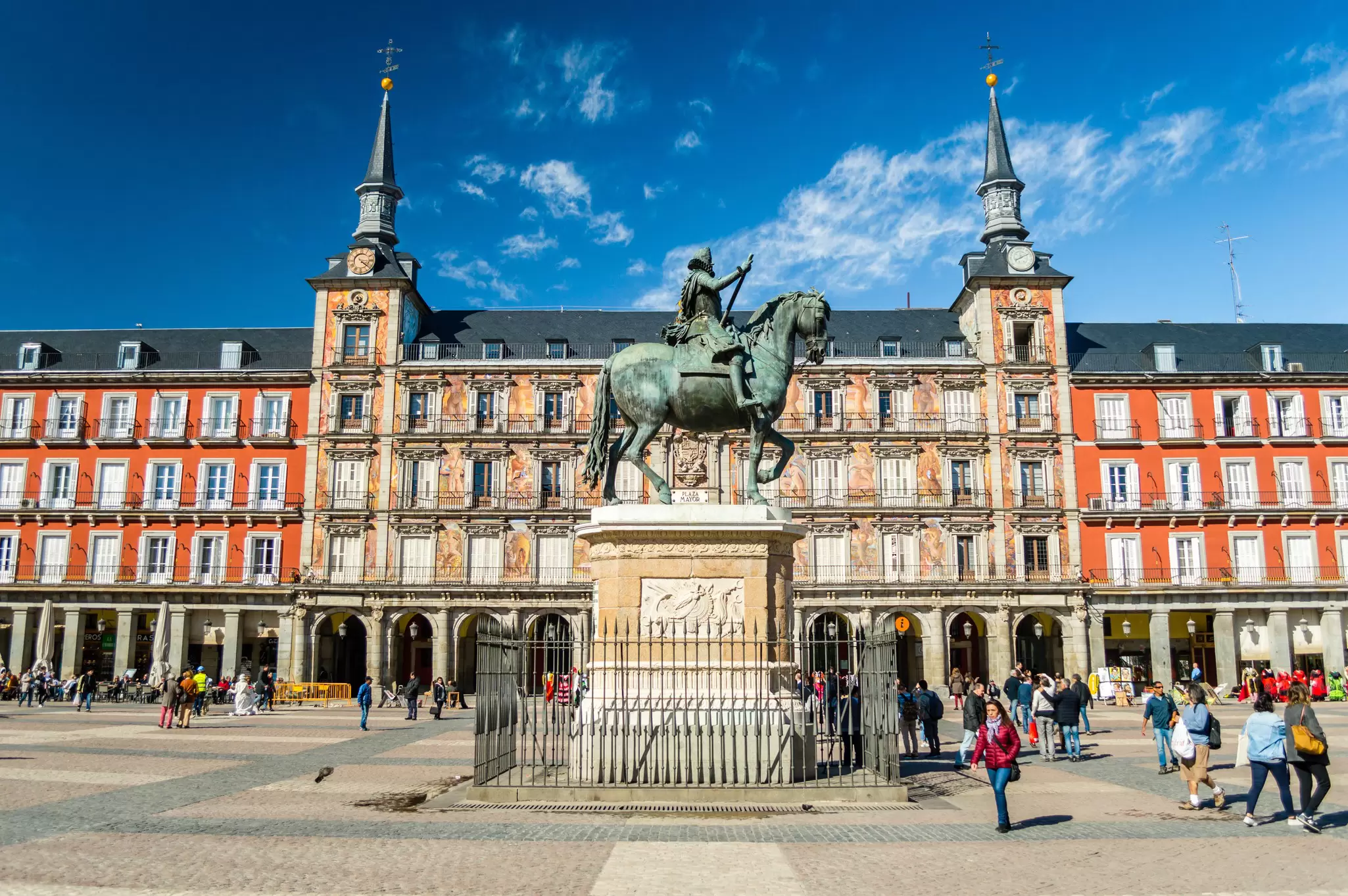 View of the Felipe III statue in front of the Casa de la Panaderia on Plaza Mayor in Madrid, Spain.