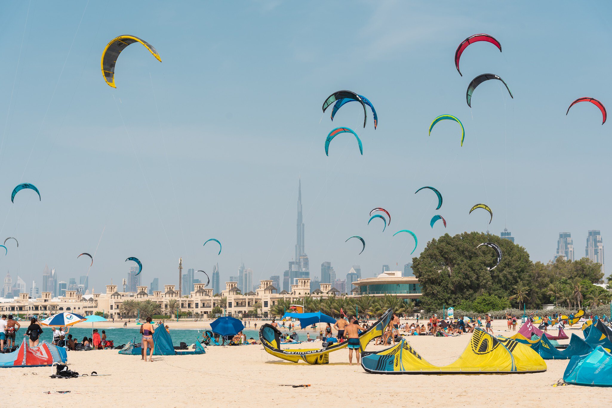 April 16th 2021, Dubai UAE, An aerial shot of Kite Beach in Dubai filled with kite surfers and their colorful kites flying in the air or being prepared on the ground, License Type: media, Download Time: 2026-05-27T21:30:52.000Z, User: lonelyplanetmedia, Editorial: true, purchase_order: 65050 - Digital Destinations and Articles, job: Comp Ingestion, client: Global Publishing WIP, other: Pia Peterson