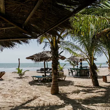 September 2014: Palm trees and wooden umbrellas in the Sanyang area.
1007725986
Sea, Sunlight, Sun, Sunny, Water, Sanyang, West Africa, Tranquility, Idyllic, Tropical Tree, Beach, Outdoors, Atlantic Ocean, Vacations, Kombo, Umbrella, Tropical Climate, Sand, Tree, Summer, Coastline, Landscape - Scenery, No People, Palm Tree, Travel, Gambia, Relaxation, Photography, Color Image, Wood - Material, Africa, Nature, Travel Destinations, Horizontal