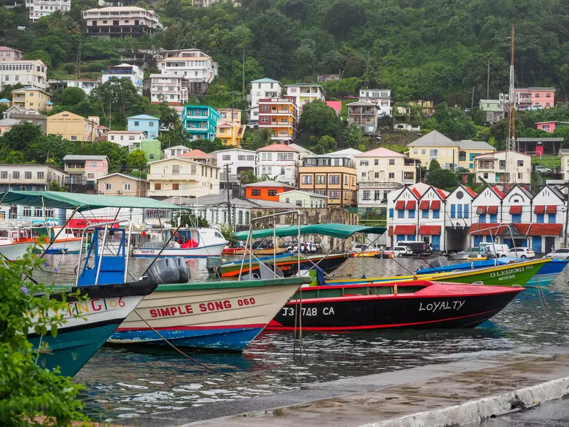 A colorful port with boats docked in the water