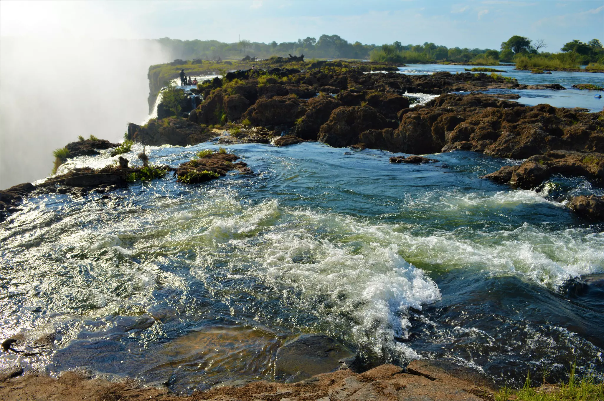 Water gushing over the edge of a cliff