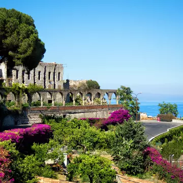 A road trip through Sicily will bring you views of gorgeous towns like Taormina. laraslk/Shutterstock