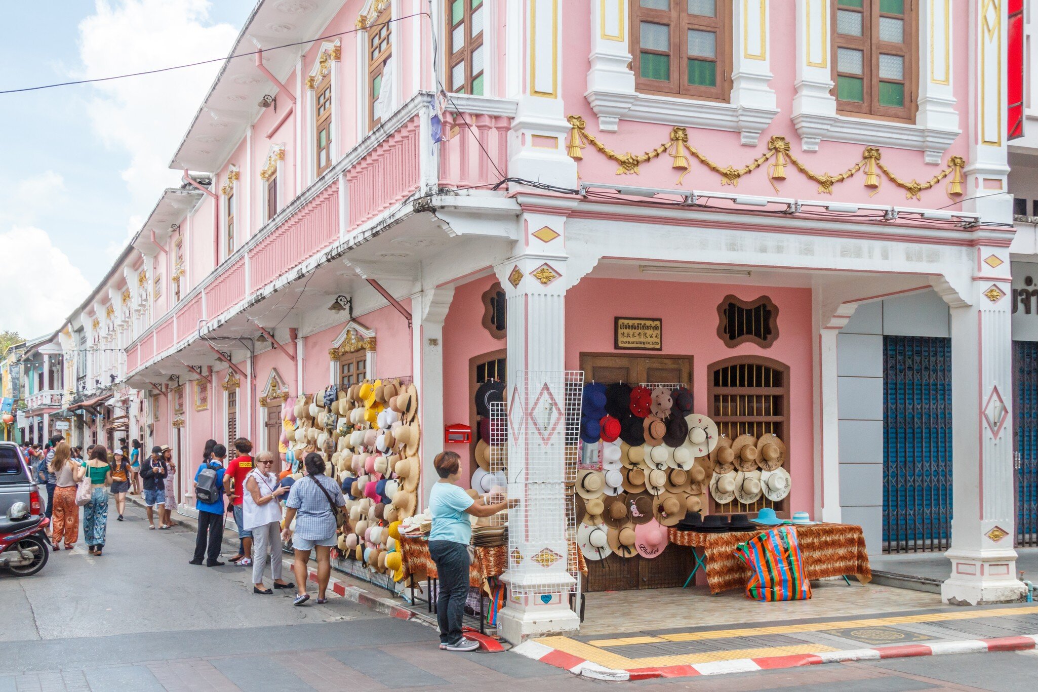 Phuket, Thailand - 2nd September 2018: tourists and hat stall, Thalang Road at junction with Soi Rommanee. Many tourists come to visit., License Type: media, Download Time: 2024-12-13T13:56:14.000Z, User: FergalCo, Editorial: true, purchase_order: 56530 - Guidebooks, job: Global Publishing WIP, client: Pocket Phuket 6, other: Fergal Condon