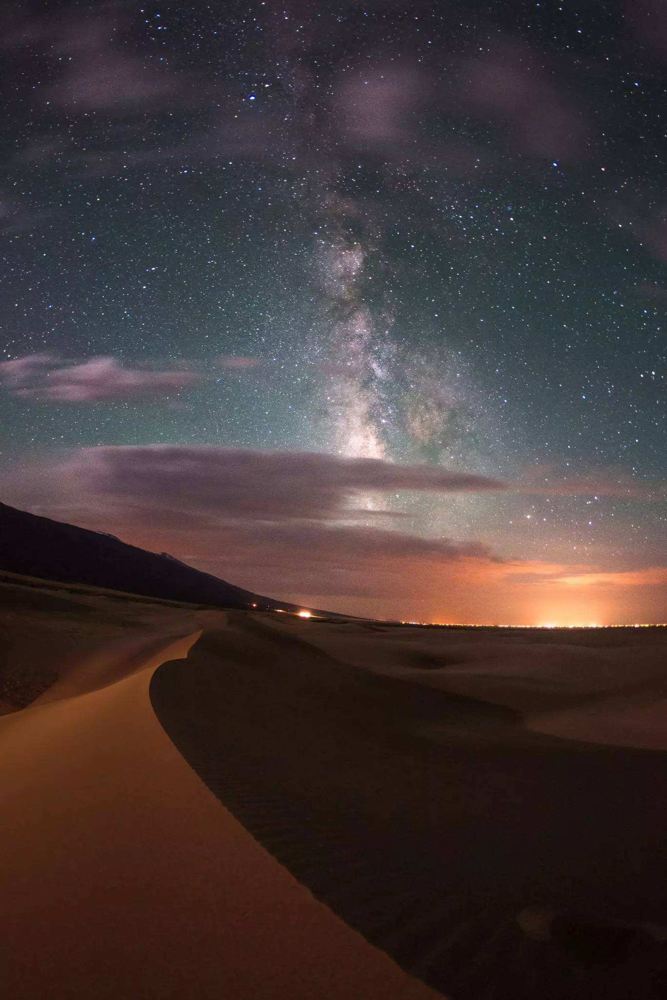 Sand dunes with the Milky Way and stars above