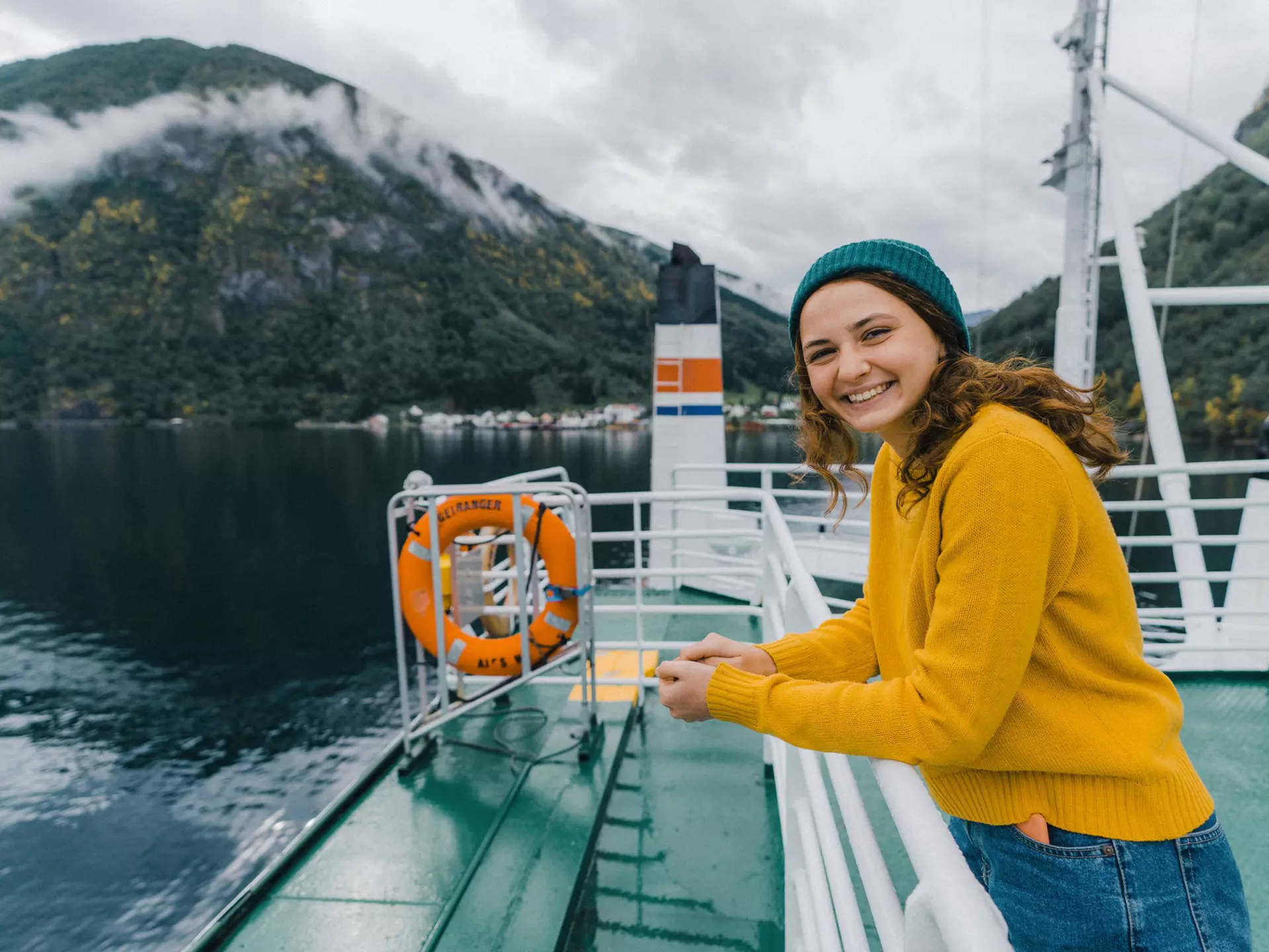 Young Caucasian woman traveling by ferry in Norway