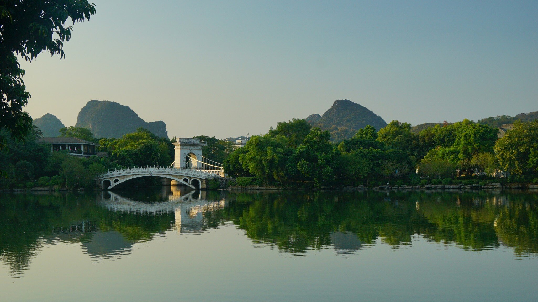 The scenery in city and city in scenery : Marble bridge, nine windings bridge in The Rong and Shan Lake in Guilin, License Type: media, Download Time: 2026-09-02T15:50:23.000Z, User: LP_NZhan, Editorial: false, purchase_order: 65050 - Digital Destinations and Articles, job: App Content, client: Lonely Planet App, other: Nadine Zhan