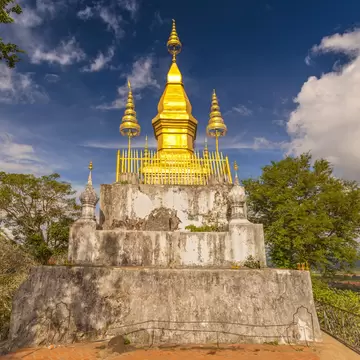 Golden Wat That Chomsi temple Stupa on Mount Phousi in Luang Prabang, Laos., License Type: media, Download Time: 2025-05-29T14:38:31.000Z, User: lonelyplanetmedia, Editorial: false, purchase_order: 65050 - Digital Destinations and Articles, job: Global Publishing WIP, client: Global Publishing WIP, other: Peterson Haggarty // SS Comp Ingestion