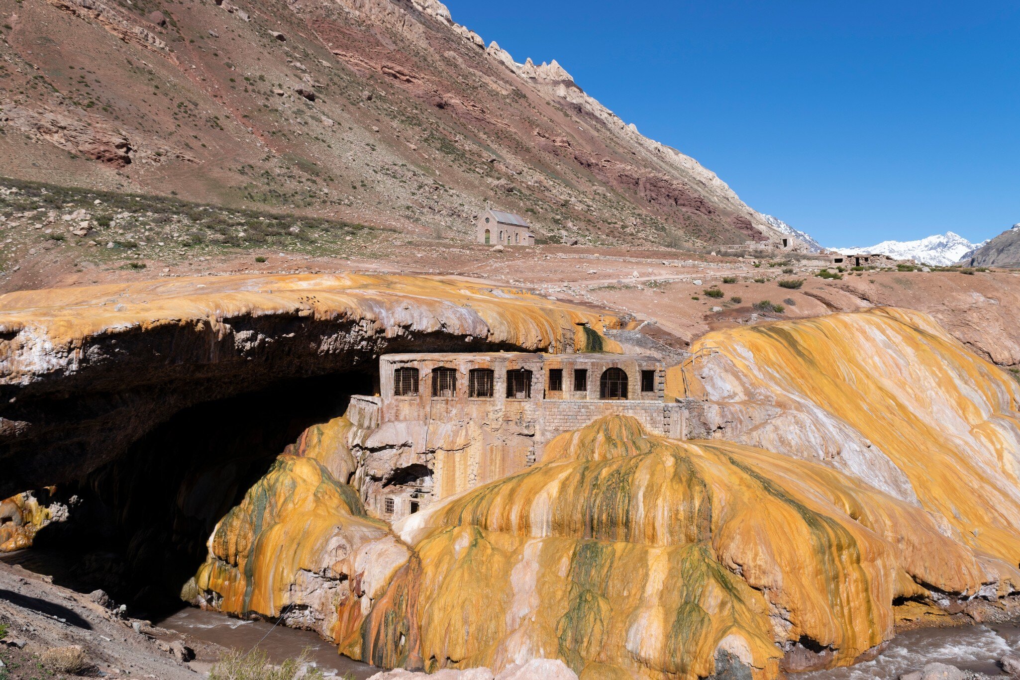 Puente del Inca, a natural bridge with historic thermal hotel ruins in the Andes mountains, Argentina.