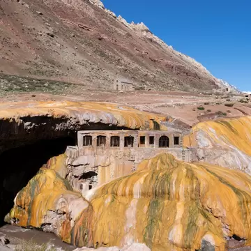 Puente del Inca, a natural bridge with historic thermal hotel ruins in the Andes mountains, Argentina.